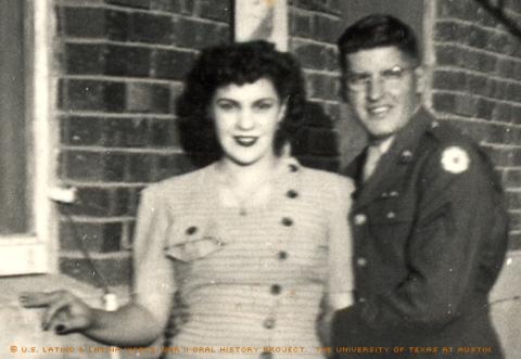 Albert Armendariz, Sr. and his wife, Mary Lou Armendariz. Photo taken El Paso, Texas between the years 1943-1947. --  The back of the photo reads,\He's got a good grip on me, huh? Looks like I was trying to run away.\""