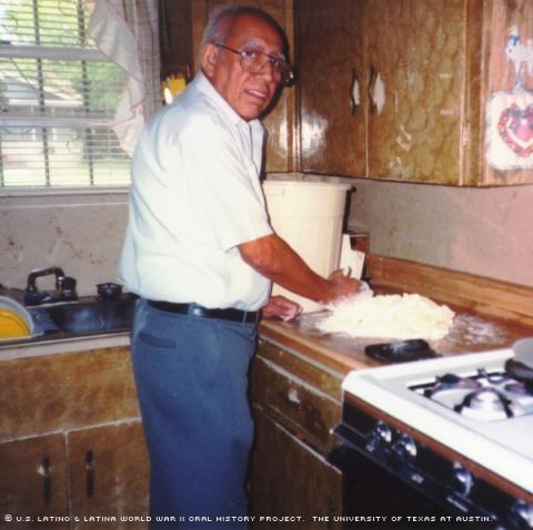 Eugene Casarez, making empanadas in his South Austin home in 2000.