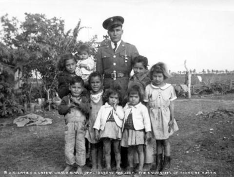 Julian Gonzales in Edinburg California in 1944 on his parents'farm with eight of his siblings.
