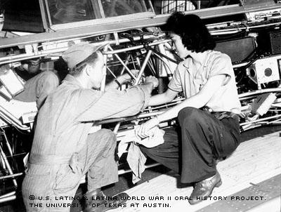 Josephine Ledesma teaches a soldier how to repair the fuselage of an airplane at Randolph Field, San Antonio, TX on Jan.1942.