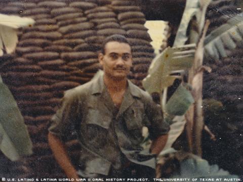 Germán Abadia-Olmeda E-4 (Specialist 4). This photo was taken in Vietnam in 1969. German was standing in front of a bunker.\Bunkers used to protect ourselves from any attack; were made of wood and sandbags; at my side some banana trees.\"-German"