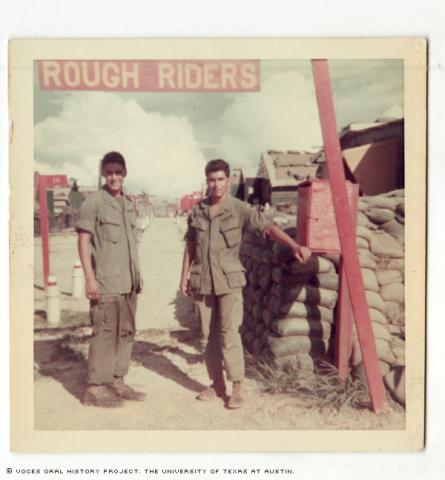 Richard Moreno (left) and Raymond Garcia (right) at the company base in Dong Ha, Vietnam in 1970. The title of their base was,\Rough Riders\"."