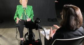 Voces Director, Maggie Rivas-Rodriguez, interviewing Petrita Sanchez in a professional studio setting.