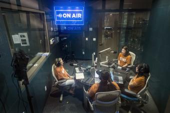 Voces Director with interns recording Hispanic Heritage Month stories at the KUT studio.