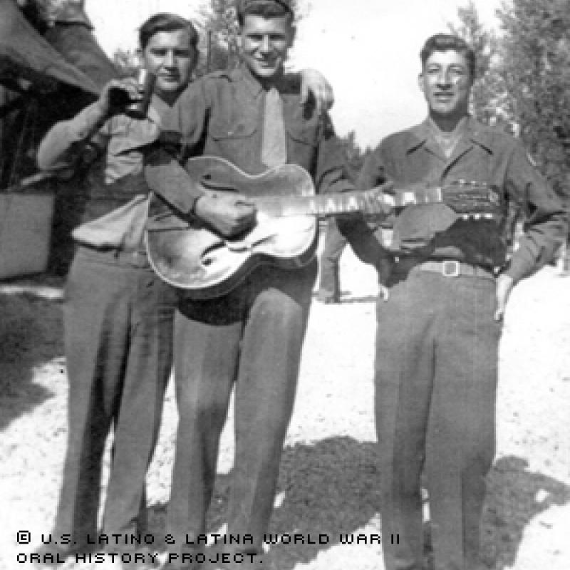 Valentin Aguilar guarding German prisoners near Naples, Italy in 1945 along with other members of the 78th Ordinance.