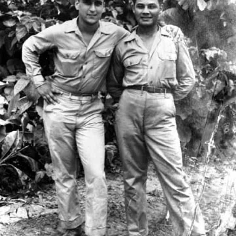 Eliseo Lopez (right) and fellow soldier Sortorio stand against the backdrop of the jungle in Bouganville, 1944.
