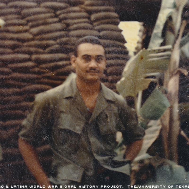 Germán Abadia-Olmeda E-4 (Specialist 4). This photo was taken in Vietnam in 1969. German was standing in front of a bunker.\Bunkers used to protect ourselves from any attack; were made of wood and sandbags; at my side some banana trees.\"-German"